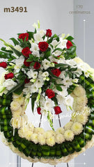 Corona Fúnebre con Gladiolas y Rosas Estrella del Cielo